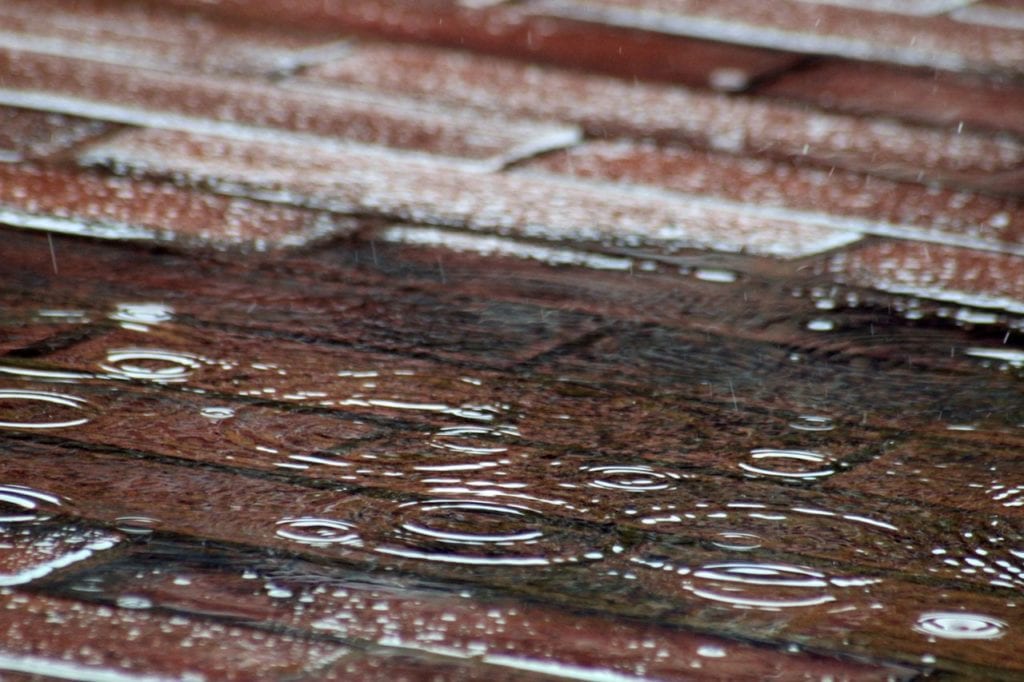 Raindrops On Red Brick Pavement
