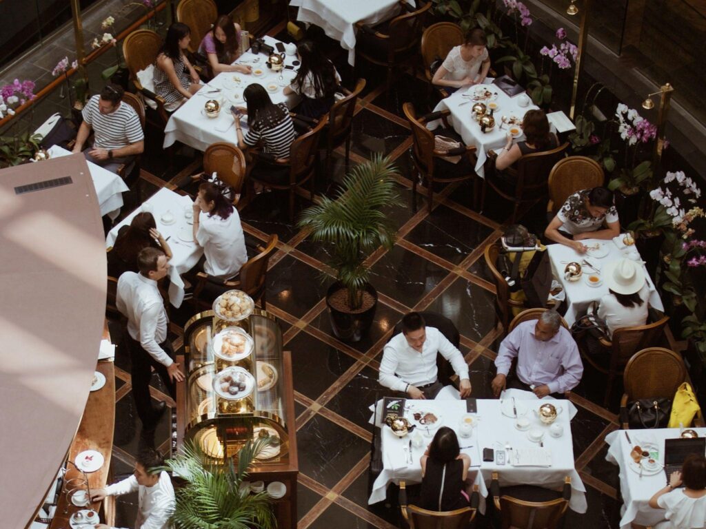 People sitting on chair in restaurant aerial view
